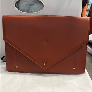 Brown Crossbody Bag with Leather Texture and Flap Closure